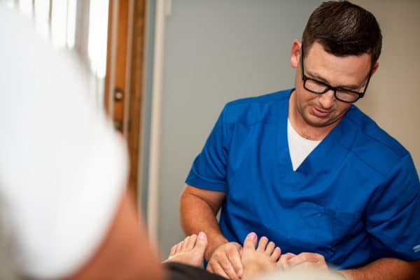 Podiatrist examining a patient's foot